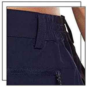 Close-up of navy blue men's sports shorts featuring elastic waistband and zipper pocket