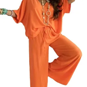 Conjunto de dos piezas para mujer con cuello en V mangas murciélago y pantalón ancho naranja