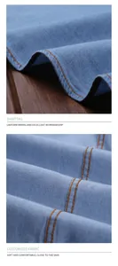 Détail macro des coutures d'une chemise en jean bleu et texture du tissu en coton doux