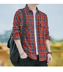 Casual red and navy plaid flannel shirt for men shown in an outdoor lifestyle setting.