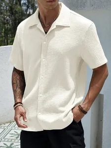 Detailed macro view of the cream waffle knit texture on men's summer casual shirt