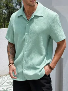 Detail view of men's mint green short sleeve shirt with unique crinkle texture fabric