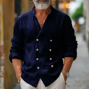 Detailed view of men's double-breasted linen shirt with stand collar and textured fabric