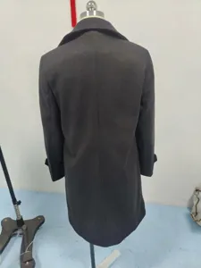 Detailed back view of a charcoal grey mid-length wool overcoat displayed on a mannequin