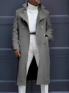 Detail of a men's slim-fit double-breasted grey wool trench coat with classic buttons.