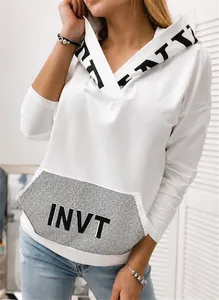 Close-up detail of white women's hoodie featuring a sequined INVT letter print pocket design