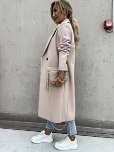Side view of a long beige woolen coat with suit collar and slim fit design