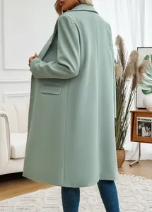 Side view of an elegant mint green long wool coat with a classic lapel collar