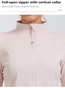 Close-up of pink yoga jacket with full-open zipper and vertical collar design detail.
