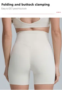 Detail view of high-waisted cream yoga shorts showing the buttock lifting seam design