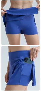 Close-up of blue sports tennis skort with built-in shorts and functional side phone pocket