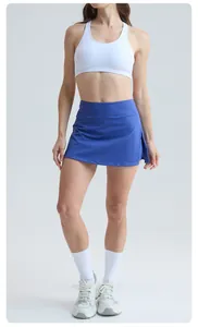 Front view detail of a blue high-waist athletic tennis skort for outdoor fitness