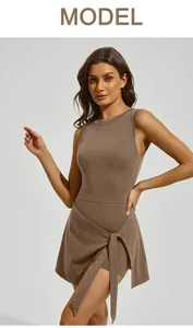 Close-up of a model wearing a brown fitness tennis skirt with tie-waist detail.