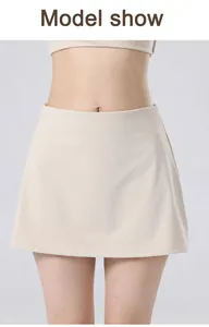 Detail showing a high-waisted beige quick-dry tennis yoga skort on a female model