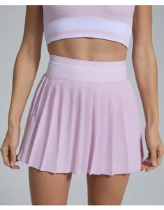 Detailed view of pink pleated tennis skirt with high waist elastic band and breathable fabric