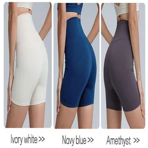 Detail of high waist yoga shorts showing Ivory white, Navy blue, and Amethyst colors