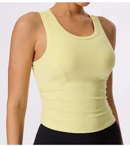 Close-up of yellow sports bra featuring ruched sides and fixed chest pads