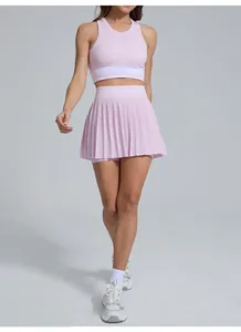 Breathable pink pleated tennis skirt set with high-waist sports bra for yoga and badminton