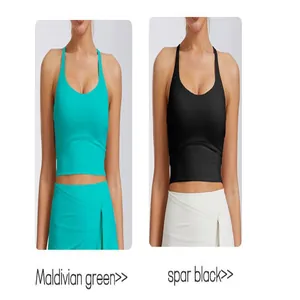 Vue détaillée de caraco de yoga de sport avec coussinets fixes en vert et noir