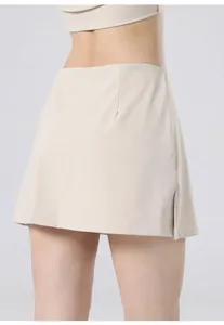 Back view of high-waist quick-dry tennis skirt with side slit detail in beige