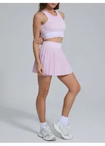 Pink pleated tennis skirt and sports bra set for women outdoor fitness training