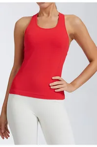 Detail of a bright red slim-fit yoga tank top with high stretch fabric and round neck
