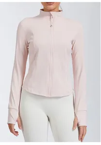 Detail view of a slim-fit pink yoga jacket featuring a stand collar and thumbholes.
