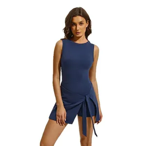 Detail view of navy blue fake two-piece tennis sports skirt with wrap front tie.