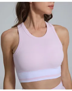 Close-up detail of a pink ribbed sports bra with a comfortable elastic band for yoga