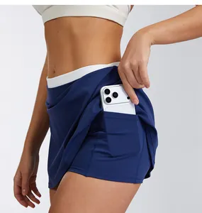 Close-up of high-waisted tennis skort detail showing functional hidden phone pocket