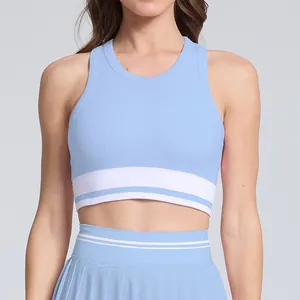 Close-up view of a light blue sports top with white stripes and matching pleated tennis skirt