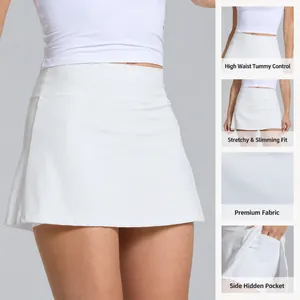 High-waisted white tennis skort with built-in shorts and side pocket for athletic wear.
