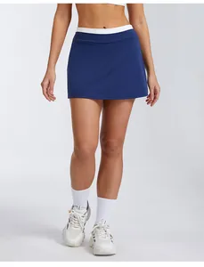 Detailed view of a high-waisted navy blue sports skort with white ribbed waistband