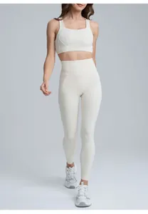 Front view of a model wearing cream high-waisted breathable quick-dry yoga leggings set