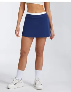 Detailed view of high-waisted navy blue athletic skort with ribbed white waistband.