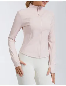 Slim fit pink quick-dry yoga jacket with stand collar, zipper and thumbholes detail.