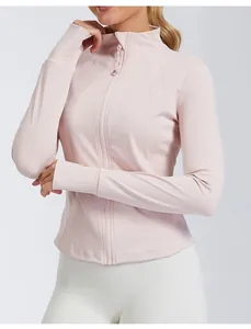 Detail view of a slim-fit pink yoga jacket with high neck and front zipper.