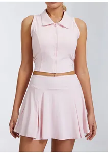 Front view detail of pink sleeveless polo collar sports tank top and pleated tennis skirt