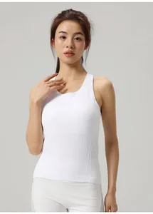 Front view of a slim fit white yoga tank top on a model with round neck detail