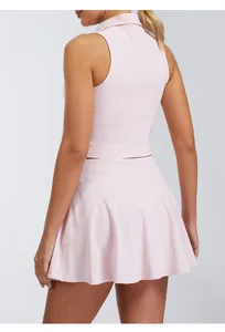 Back view of a women's pink sleeveless quick-dry polo tennis top and matching skirt