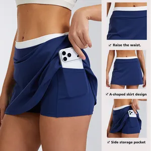 Navy blue high waisted colorblock athletic skort featuring side phone pocket and A-line design
