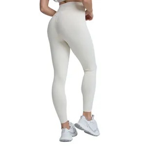 High-waisted cream yoga leggings for women with peach butt lift and breathable fabric.