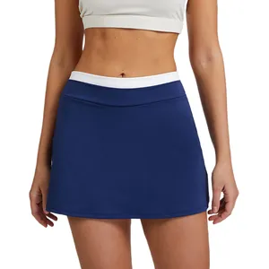 High waisted navy blue tennis skort featuring white ribbed waistband and anti-exposure liner