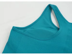 Close-up of teal yoga tank top neckline showing high-elastic ribbed texture
