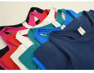 Multi-color seamless ribbed yoga tank tops with fixed pads and crew neck detail