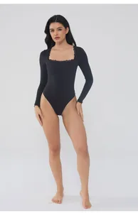 Detailed full body shot of a black long sleeve bodysuit with elegant lace trim square neck