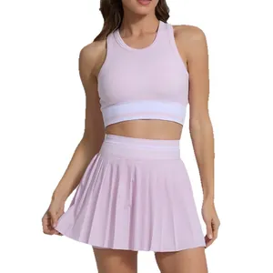 Two-piece pink pleated tennis skirt and crop top set for breathable outdoor fitness and yoga