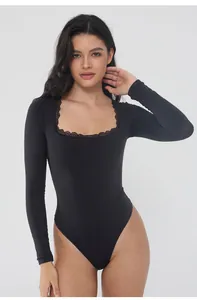 Detail view of black long sleeve shapewear bodysuit with lace square neckline