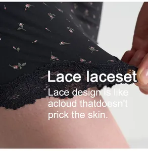 Detail of soft lace trim on black floral bodysuit showing comfort on skin