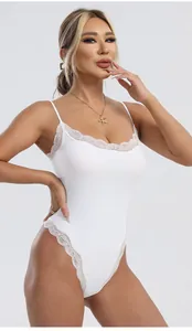 Close-up of white bodysuit featuring delicate lace trim and double spaghetti straps
